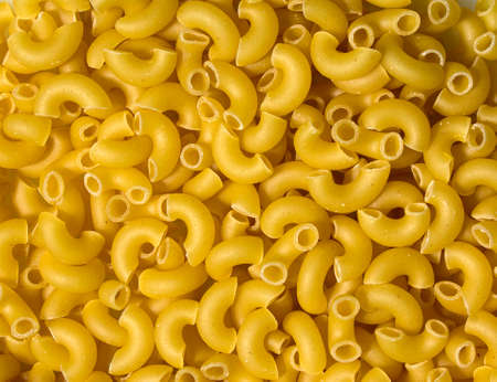 Texture of pasta in the form of an arc. Pasta close-up twisted horns. Raw pasta heart shaped horns.の写真素材
