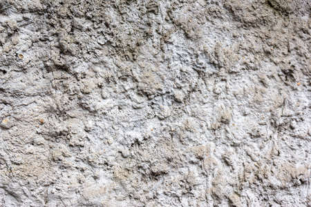 Grungy dark concrete wall for background. Cement texture use for background. Covering the basement of the walls of houses with cement mortar. Construction, technologies.の写真素材