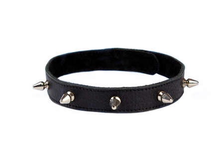 Black collar with black lining, rivets, spikes on a white background. Collar with metal spikes for games. Dressed around the neck. Isolate. Place for textの写真素材