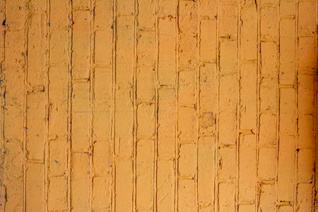 Abstract yellow color brick wall texture for background. Textured Background Illustration. Abstract weathered texture stained old stucco yellow color brick and aged paint yellow color brickの写真素材