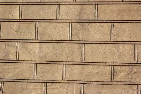 Abstract yellow color brick wall texture for background. Textured Background Illustration. Abstract weathered texture stained old stucco yellow color brick and aged paint yellow color brickの写真素材