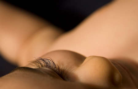 A child sleeping showing his silky eylashes in a studio setup moodの写真素材