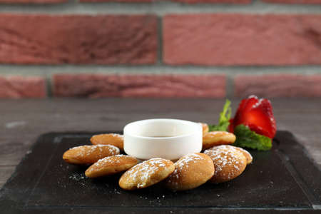 Mini pancakes with strawberry & syrup