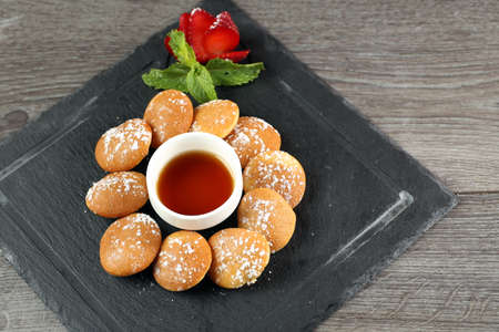 Mini pancakes with strawberry & syrupの写真素材