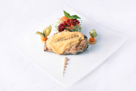 Grilled chicken breast with mushroom sauce & vegetablesの写真素材