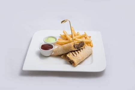 A low contrast Hero shot of a beef wrap sandwich with samurai & alger sauce and fries on the side, on a minimal white background with a 45 degree angle from front zoomed in perspectiveの写真素材