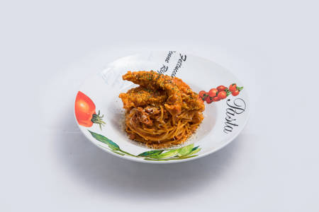 A low contrast Hero shot of chicken curry with pasta noodles in a plate with minimal white background with 60 degree angle from front perspectiveの写真素材