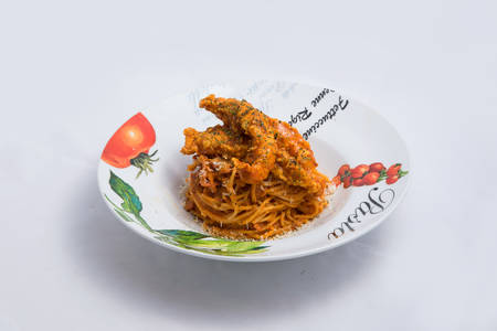 A low contrast Hero shot of chicken curry with pasta noodles in a plate with minimal white background with 60 degree angle from front perspectiveの写真素材