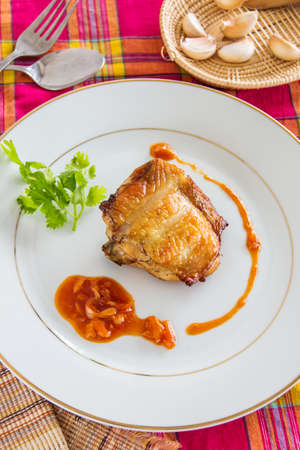 Grilled chicken with red sauce and garlic, thai cuisine.の写真素材