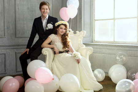 Cute Teenage Prom Couple in beautiful interiorの写真素材