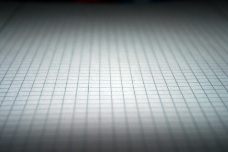 squared paper darkened as backdrop