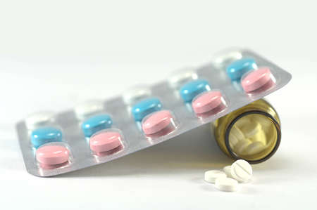 Medicine coloured and white pills for healing illness