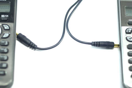 Connection between two grey radiophones over white