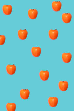 A beautiful asymmetrical pattern made of delicious, juicy and healthy Japanese red-orange kaki...