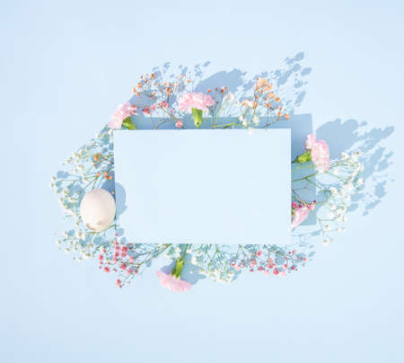 Bright Easter spring creative arrangement. Delicate flowers of gypsophila and carnations of white...