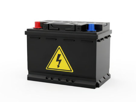A black car battery with red and blue terminal covers, a yellow triangle high voltage warning symbol, isolated on a white background. Power source.の写真素材