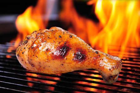Grilled chicken leg on the grill の写真素材