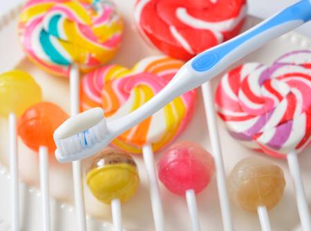 toothbrush on candy backgroundの写真素材