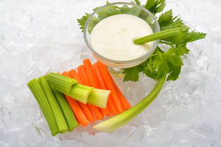vegetables and salad cream on iceの写真素材