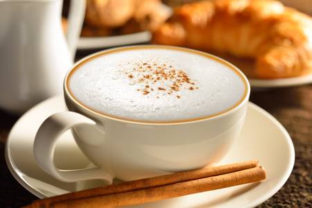 	A cup of cappuccino and croissantの写真素材