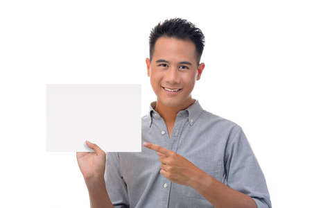 Young man holding blank billboardの写真素材