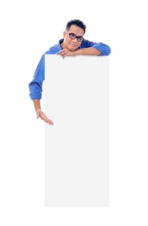 Young man holding blank billboardの写真素材
