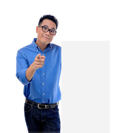 Young man holding blank billboardの写真素材