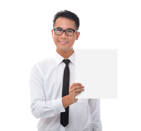 Young businessman holding blank billboardの写真素材