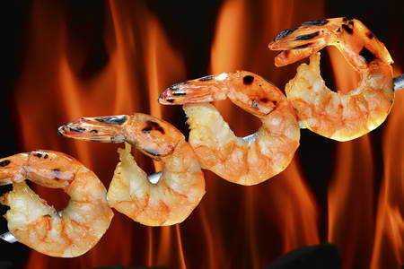 Grilled shrimps on the flaming grillの写真素材