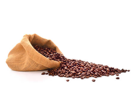 Coffee beans in bag isolated on whiteの写真素材