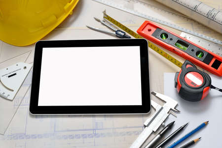 Tablet computer with architectture and construction tools and blueprintsの写真素材