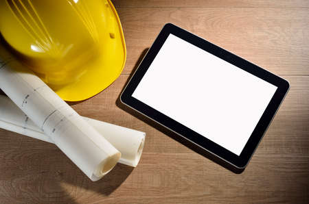 Tablet computer with architectture and construction tools and blueprintsの写真素材