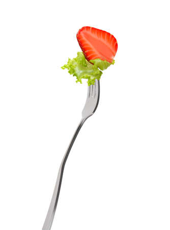 Mixed salad on fork isolated on whiteの写真素材