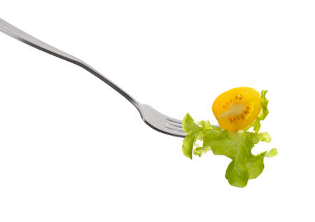 Mixed salad on fork isolated on whiteの写真素材