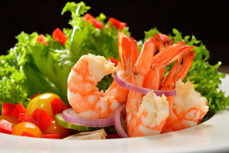 Fruit and vegetable salad with shrimpsの写真素材