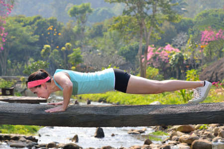 Middle aged woman exercising in the parkの写真素材