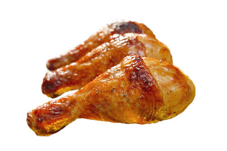 Grilled chicken legs isolated on white backgroundの写真素材