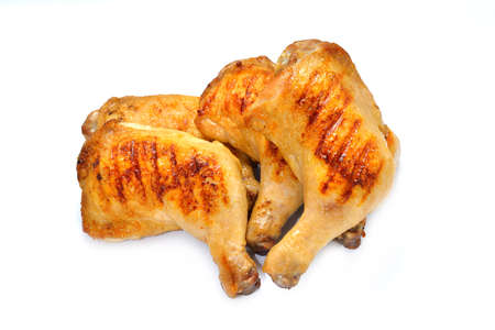 Grilled chicken thighs isolated on white backgroundの写真素材