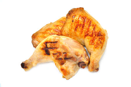 Grilled chicken thighs isolated on white backgroundの写真素材