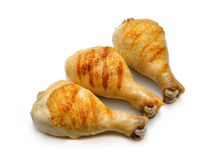 Grilled chicken legs isolated on white backgroundの写真素材