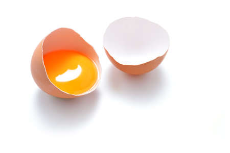 Close up of cracked egg isolated on white background