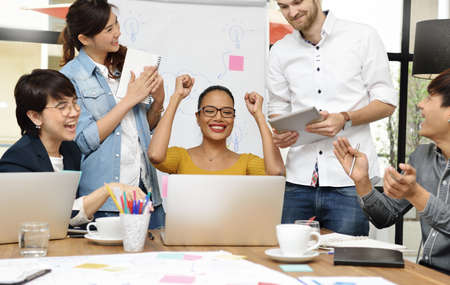 Group of businesspersons having different age in creative business discussing work in the officeの写真素材