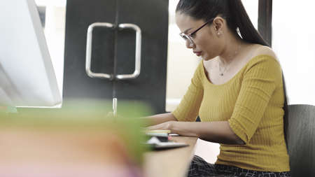 Happy senior businesswoman working in the officeの写真素材