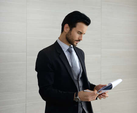 Portrait of young business man working in officeの写真素材