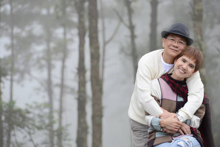 Portrait of happy romantic senior couple outdoorsの写真素材