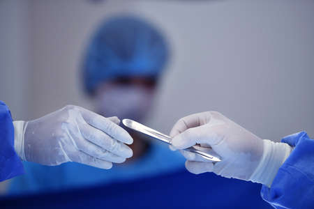 Team surgeon at work on operating room in hospitalの写真素材