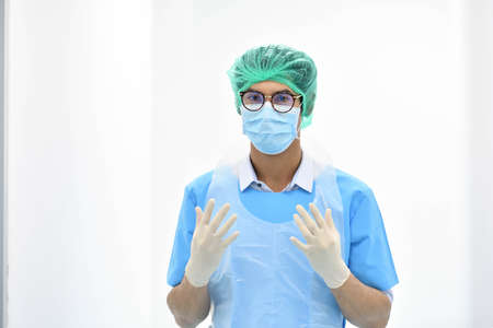 Asian male obstetrician with mask ready for operation in hospitalの写真素材