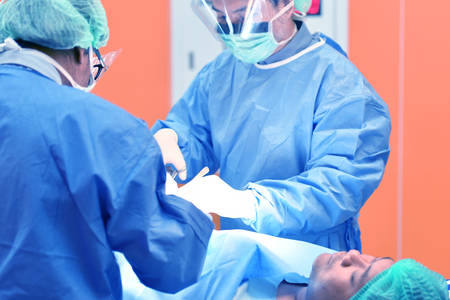 Team surgeon at work on operating room in hospital