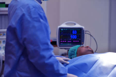 Team surgeon at work on operating room in hospitalの写真素材