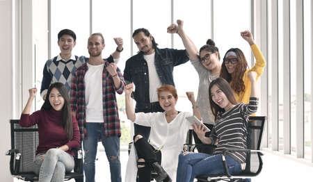 Group of businesspersons feeling happy and cheering successful work